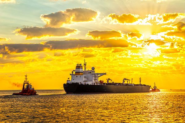 Tugboat Pulling a Freighter